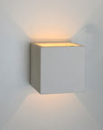 Jolie applique en céramique blanche qui illumine par dessous en par dessus avec une belle lumière chaude