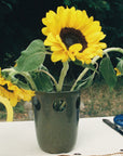 Vase kaki avec tournesol